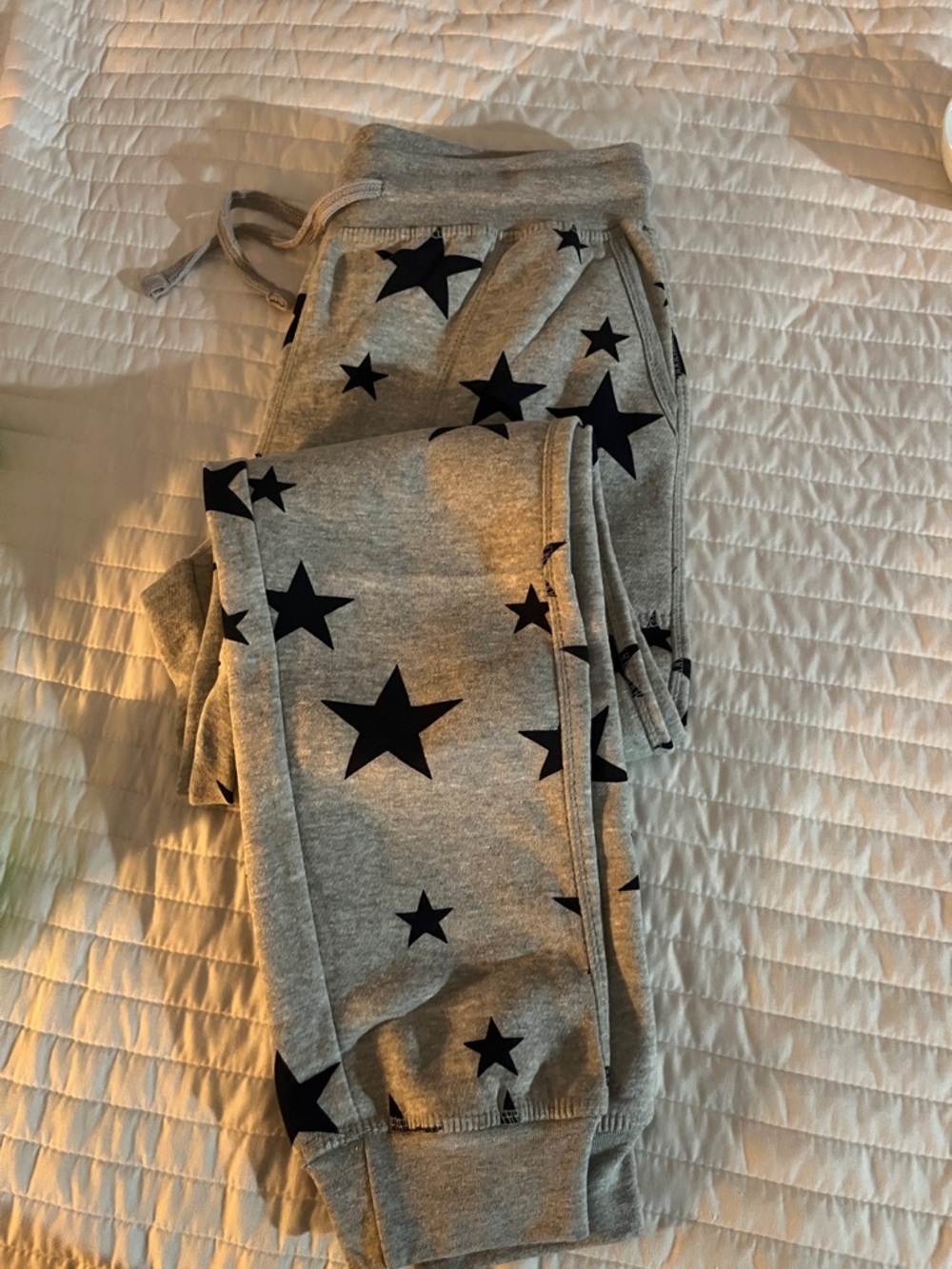Gray Star Print Women’s Jogger Pants. They are about a size 12. Never worn